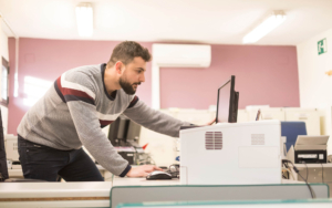 Person at desk looking at computer monitor