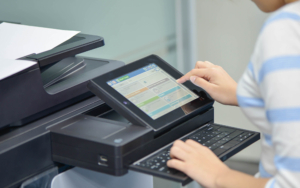 Side view of person using printer keyboard