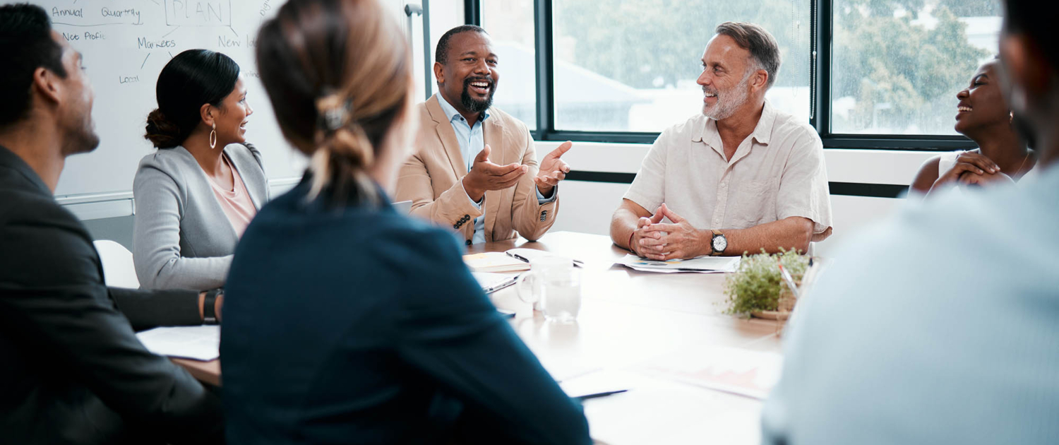 Large group of people at meeting table