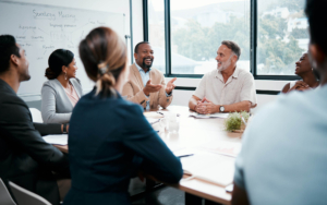 Large group of people at meeting table