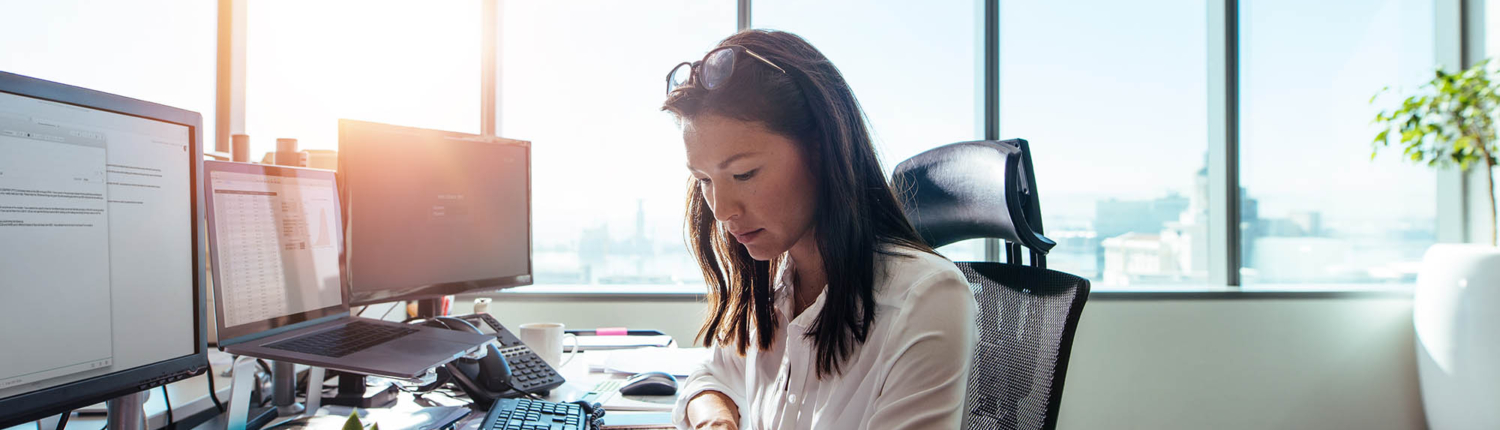 Person at desk looking over documents