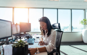 Person at desk looking over documents