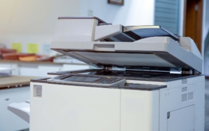 The photocopier or network printer is office worker tool equipment for scanning and copy paper