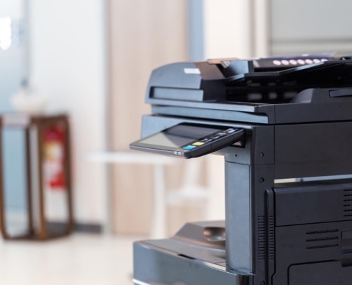 Side view of a large multi function printer and copier