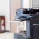 Side view of a large multi function printer and copier