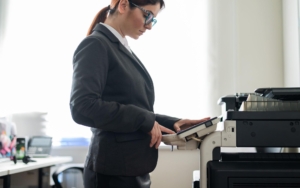 sideview of office woman printing