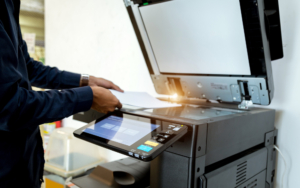 Bussiness man Hand press button on panel of printer