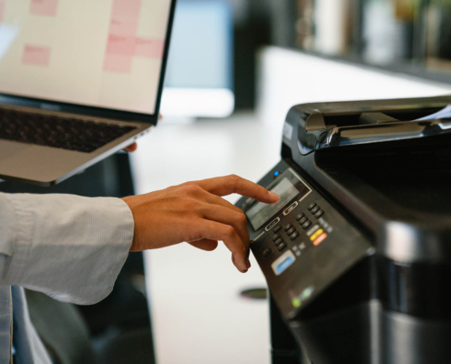 Close up view of person using office printer