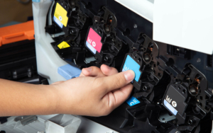 Person changing toner in laser multi function printer