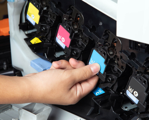 Person changing toner in laser multi function printer