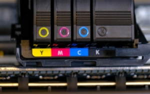 Close-up photo of yellow, magenta, cyan, and black ink cartridges